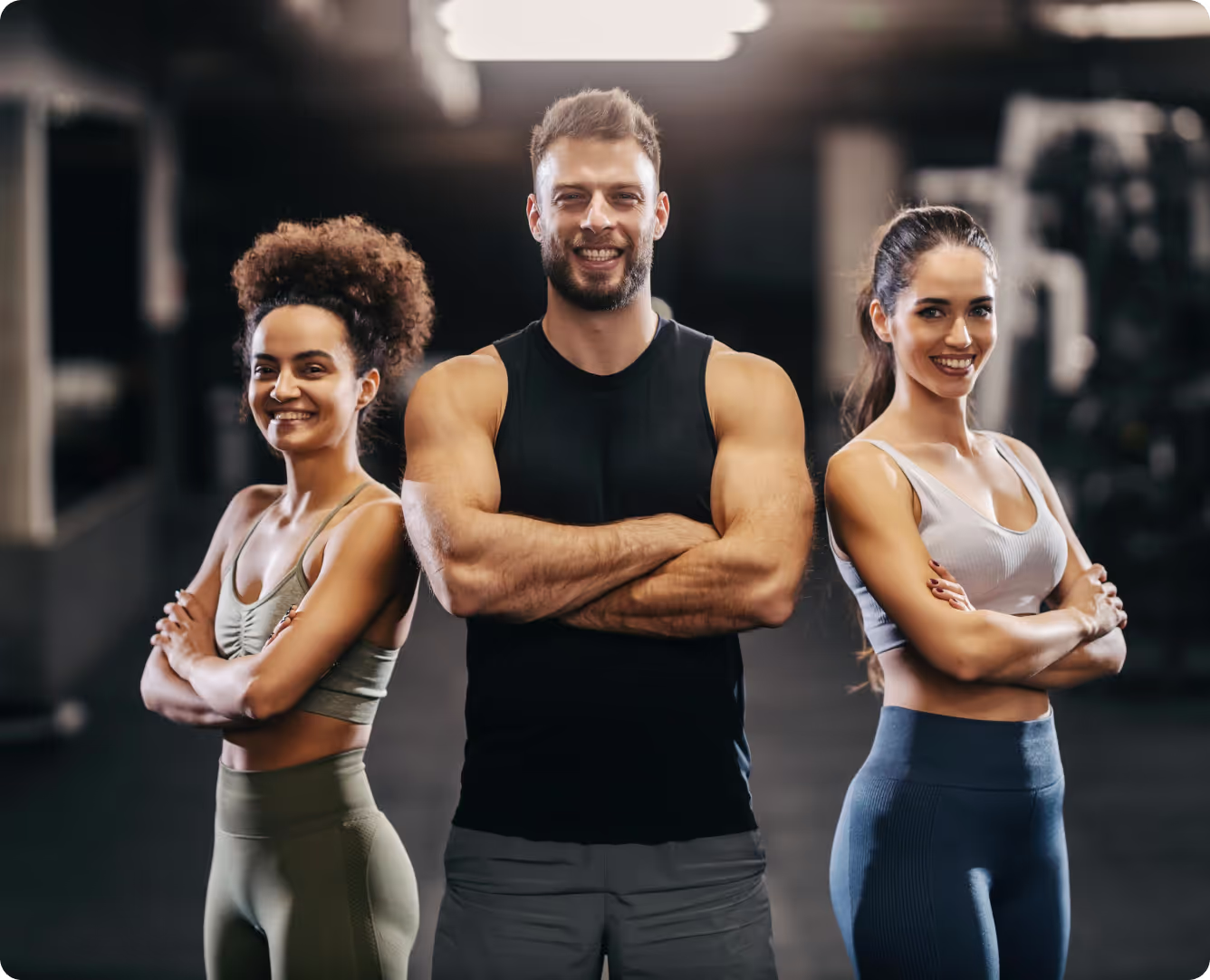 3 personal trainers standing proud